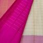 Handwoven Warm Ivory Kanjipuram saree with magenta, purple and aubergine Ettukol border.