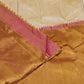 Warm Ivory pure mulberry silk saree with expansive antique-gold Ettukol border.