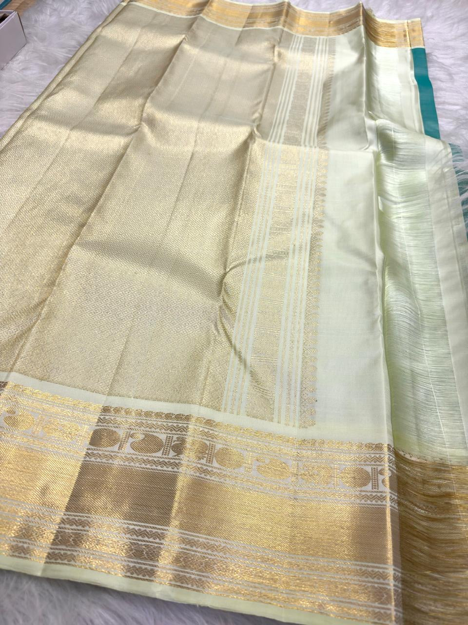 Warm Ivory gold zari pallu on Aqua Teal Pure Silk Kanchipuram Korvai saree