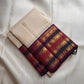 Warm Ivory Pure Silk Kanchipuram saree with petite gold buttas and handwoven multi-stripe elephant zari border.