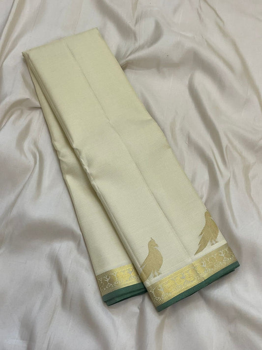 Warm Ivory Kanjipuram silk saree draped, full length view — Idam Living