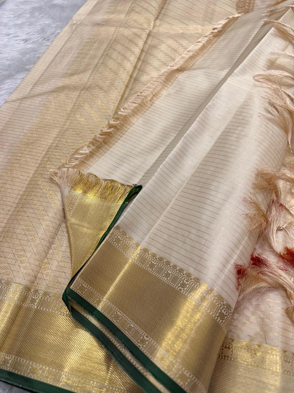 Warm Ivory Kanchi Pattu silk saree, body weave texture close-up — Idam Living
