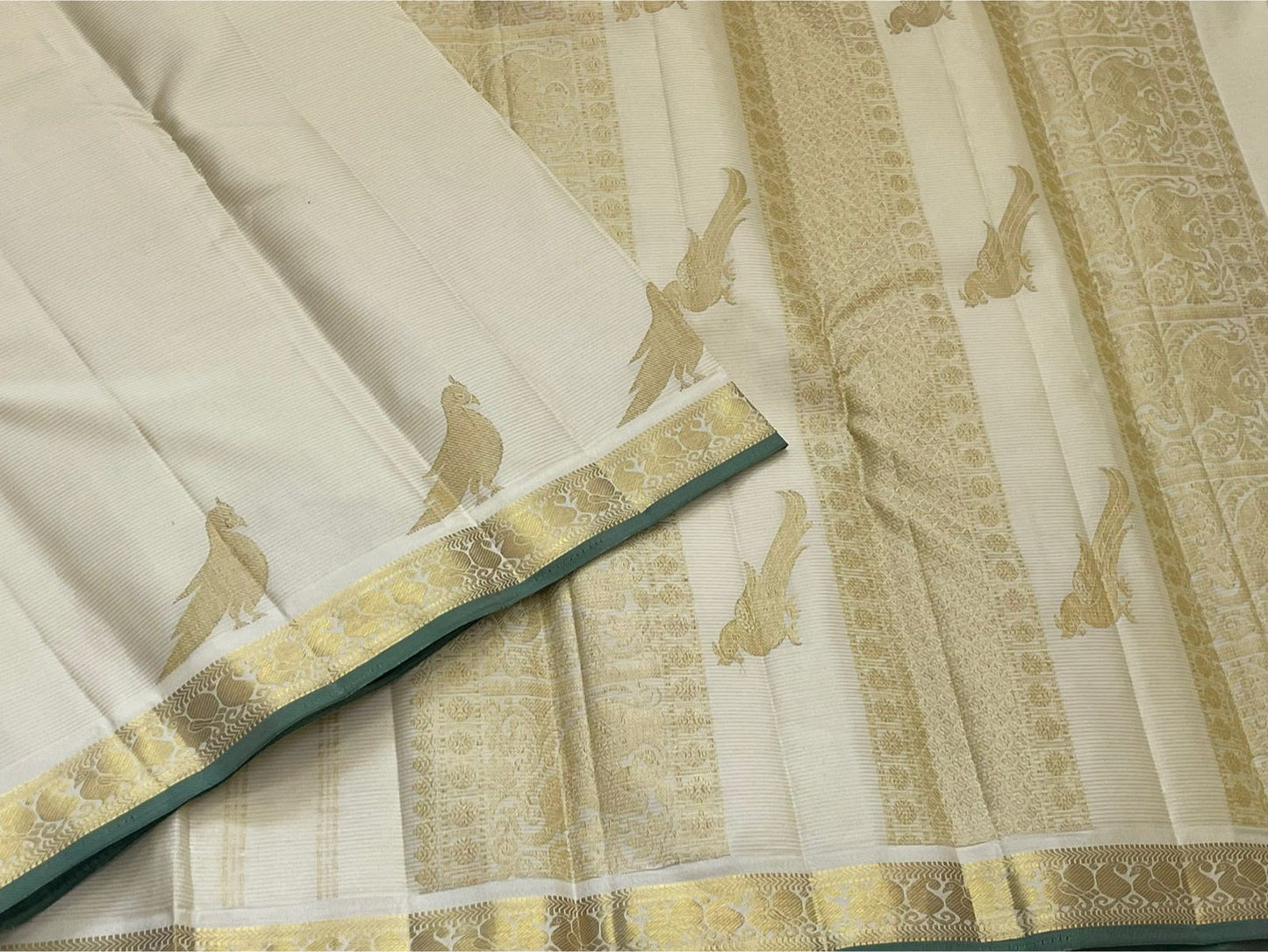 Warm Ivory Kanjipuram silk saree, zari Kili parrot motif close-up — Idam Living