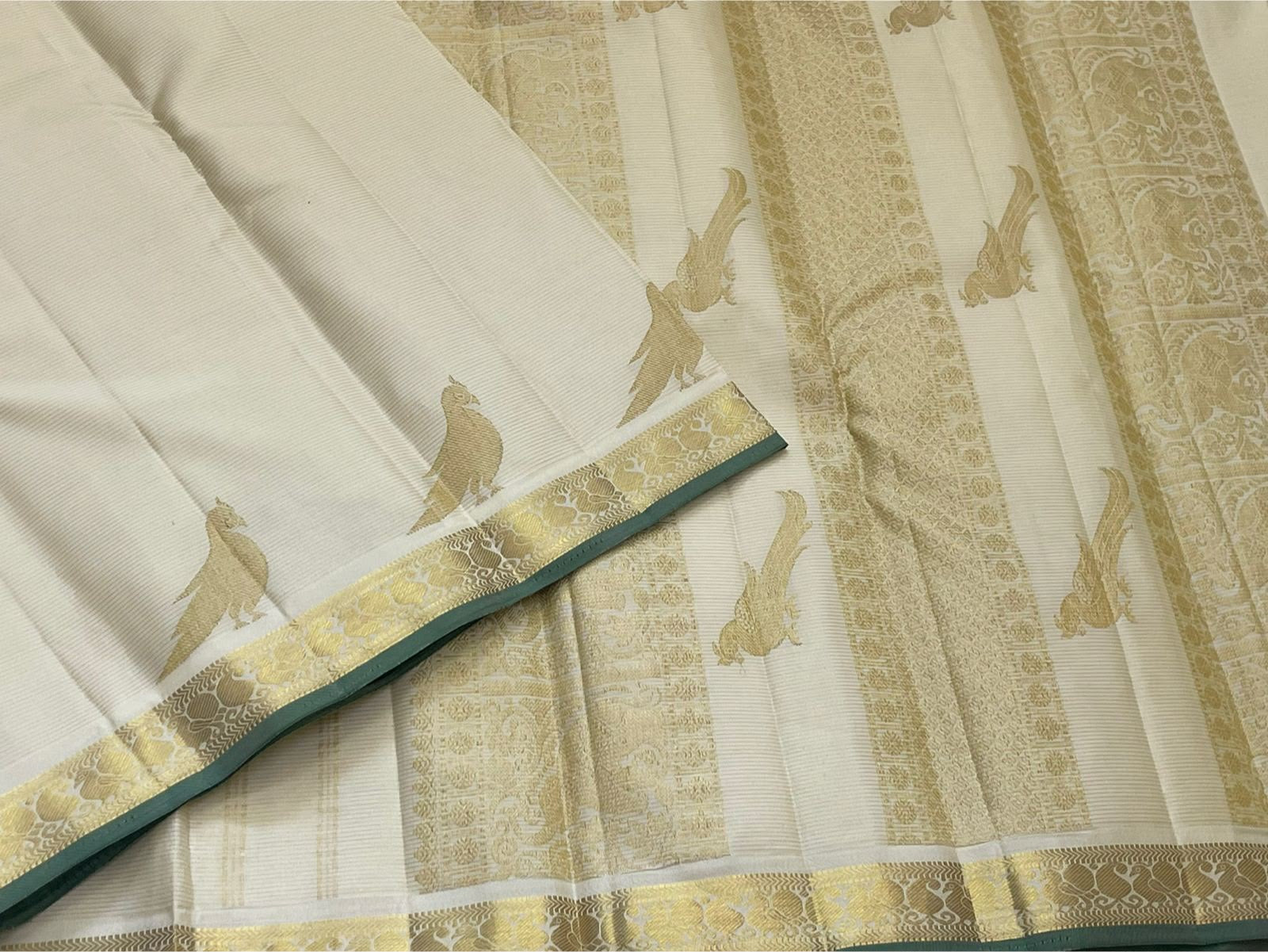 Warm Ivory Kanjipuram silk saree, zari Kili parrot motif close-up — Idam Living