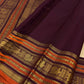 Rich Aubergine Purple pallu with dense antique-gold zari weaving and Burnt Orange registers.