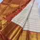 Warm-ivory pure silk Kanjipuram Korvai saree with Kamalam and Mayil buttas, full drape — Idam Living
