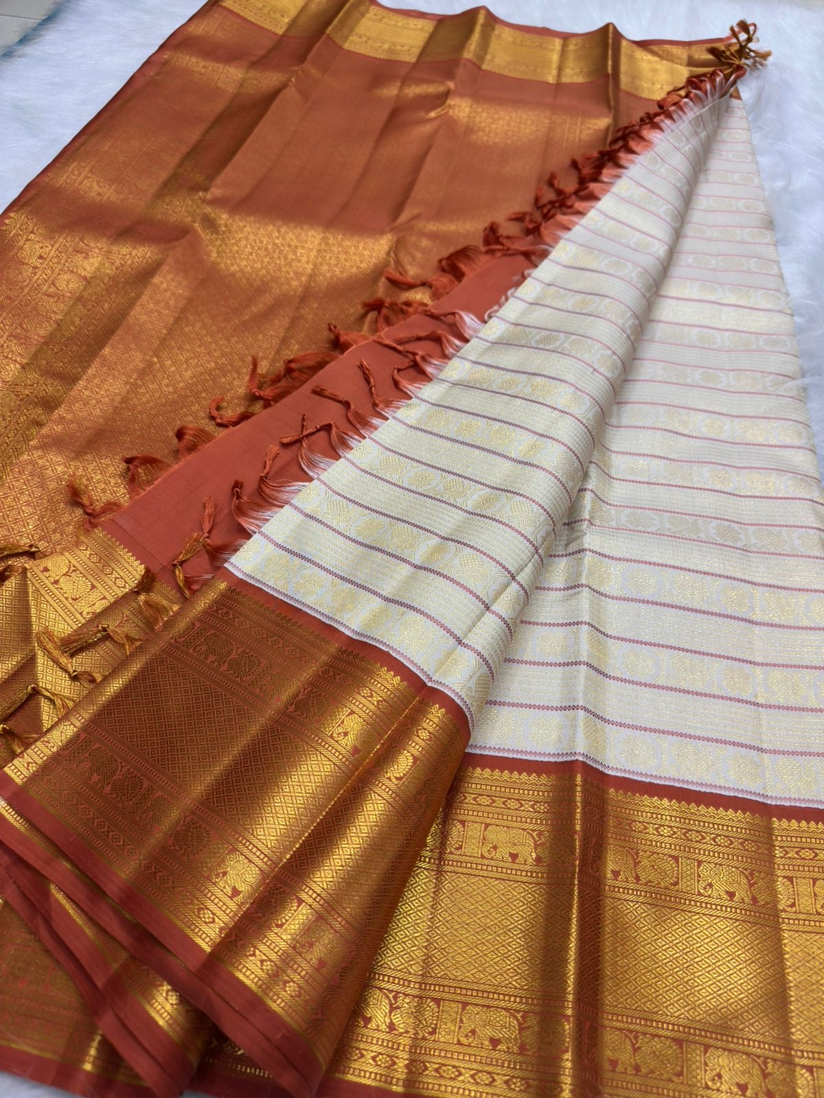 Warm-ivory pure silk Kanjipuram Korvai saree with Kamalam and Mayil buttas, full drape — Idam Living