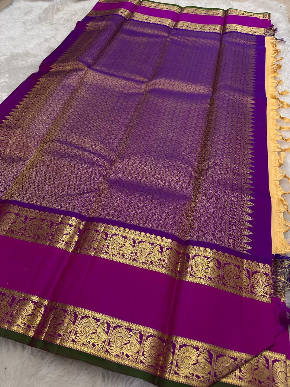 Warm ivory Kanchipattu saree with raspberry pink rettapet border — traditional gold zari — Idam Living