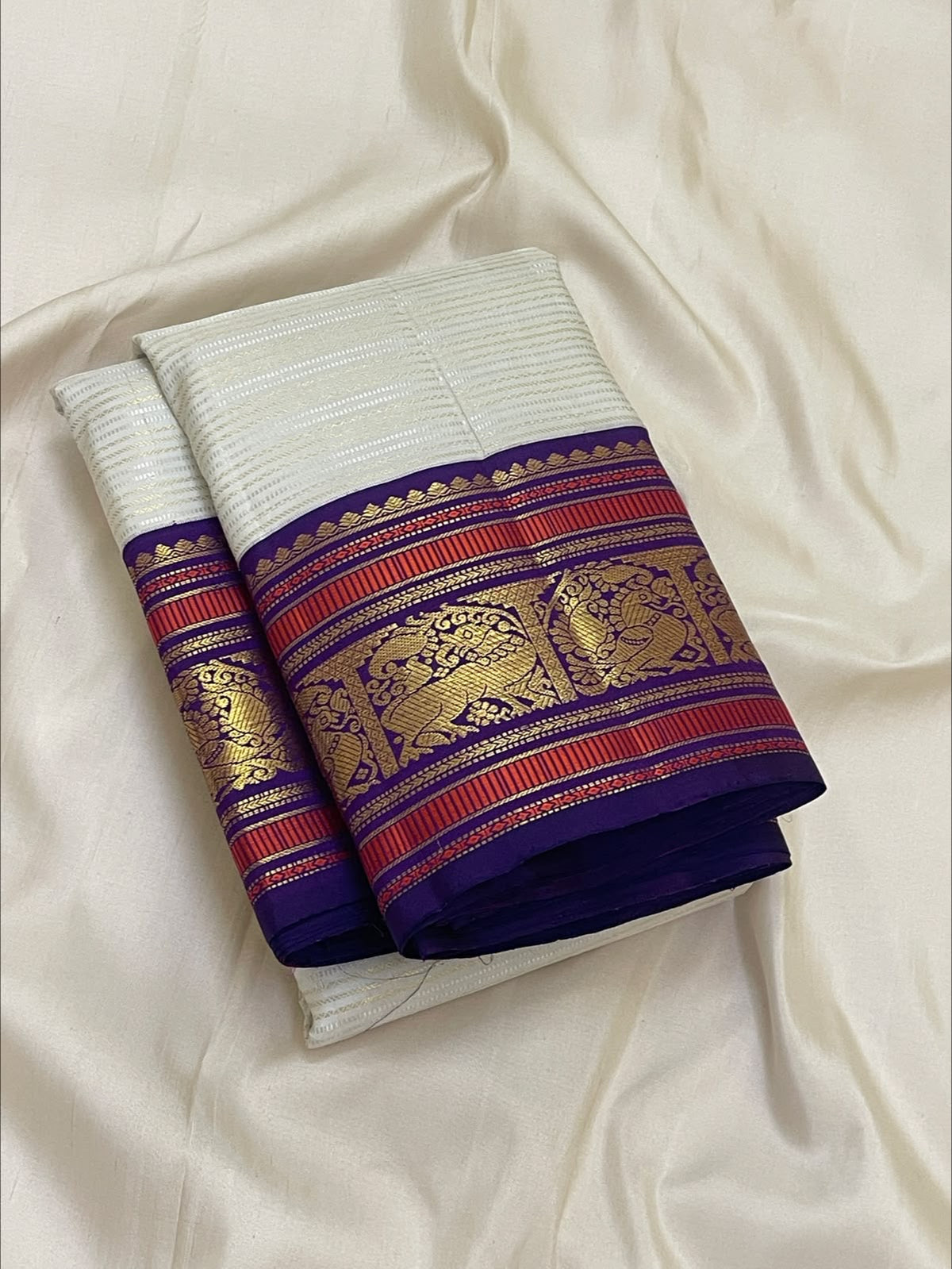 Warm Ivory Handwoven Pure Silk Kanchipuram Saree with Purple Border and Veldhari Detail, pallu detail