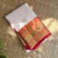 Warm Ivory Kanchipuram Saree — raspberry-magenta Korvai border with gold zari peacocks and floral vines
