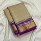 Warm ivory taupe Kanjipuram silk saree with royal purple border, full view