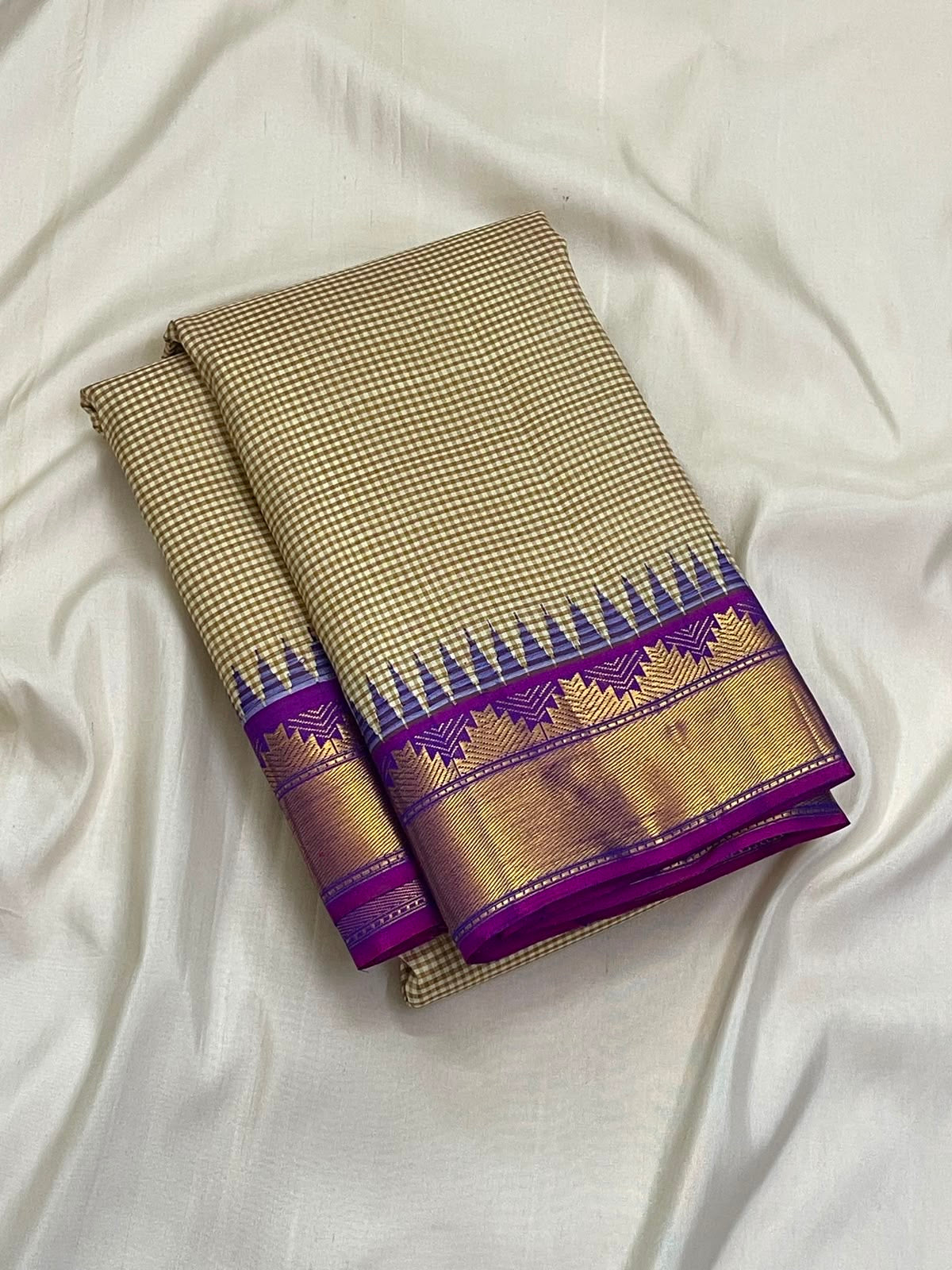 Warm ivory taupe Kanjipuram silk saree with royal purple border, full view
