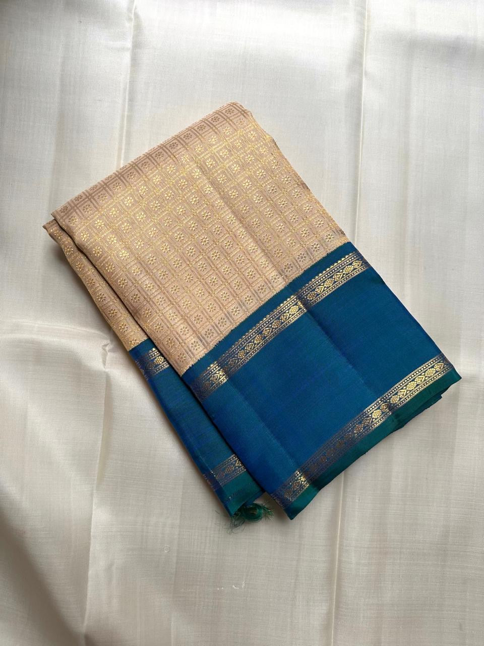 Warm Ivory Handwoven Pure Silk Kanjivaram Saree with Zari Kattam and Peacock Blue-Green Shot Border