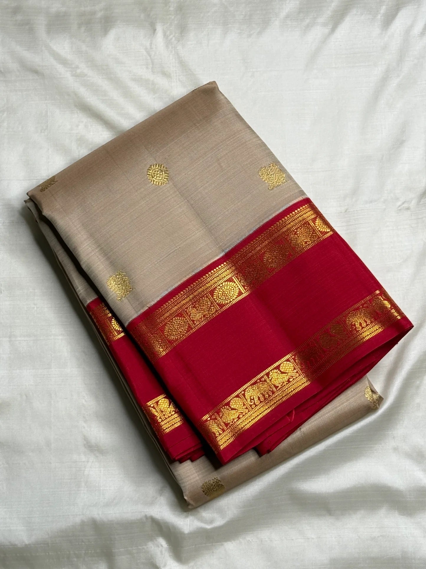 Pallu view showing the dense gold zari field against the rani pink ground