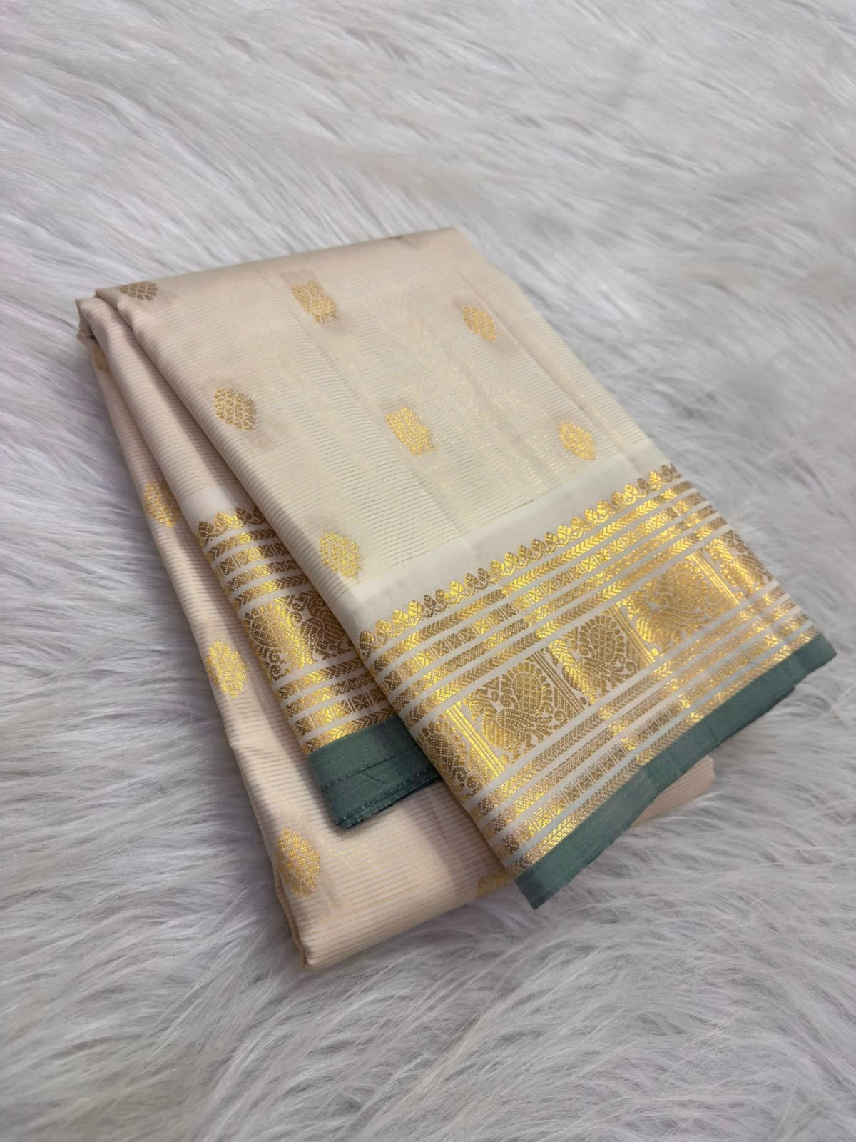 Warm Ivory lightweight Pure Silk Kanchipuram Vairaoosi saree with gold zari buttas