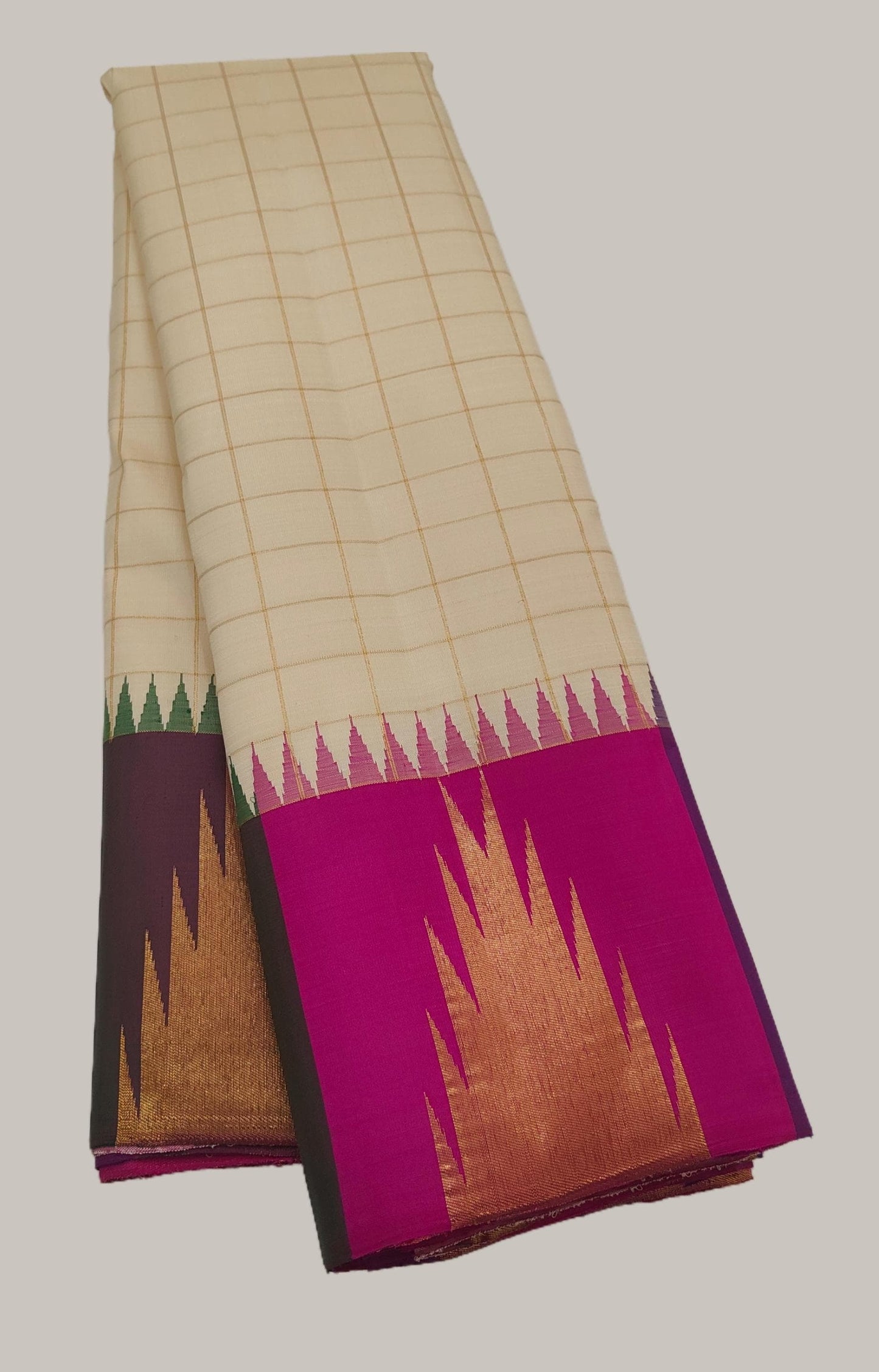 Close view of multicolour temple-like edging on a Warm Ivory pure silk Ettukol Kanchipuram saree.