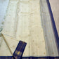Warm Ivory pure silk Kanjivaram Korvai saree with Mayil Kazhuthu blue-green gold zari border.