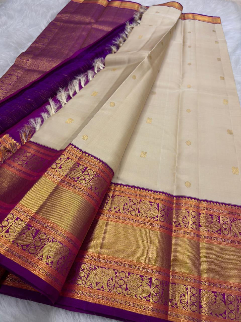 Warm Ivory Handwoven Pure Silk KanchiPattu Korvai Saree with Vadamalli Purple Yaanai Zari Border