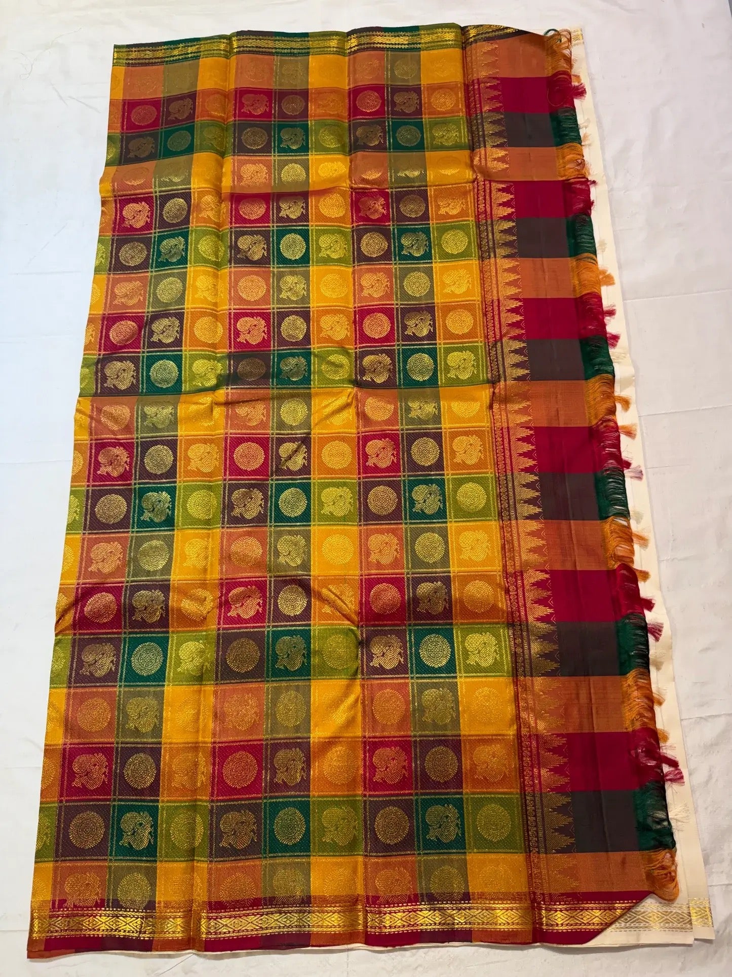 Warm Ivory pure silk Kanchipuram Paalum Pazhamum saree with coloured silk-thread buttas.