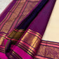 Close view of a gold zari flower-bunch butta woven with paisley detailing on Warm Ivory silk.