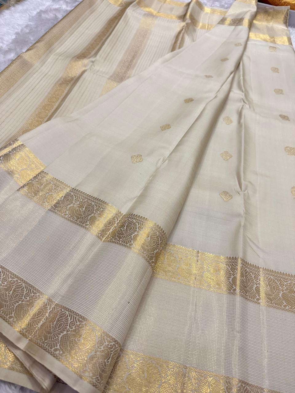 Warm Ivory Pure Silk Kanchipuram saree with petite scattered gold zari buttas