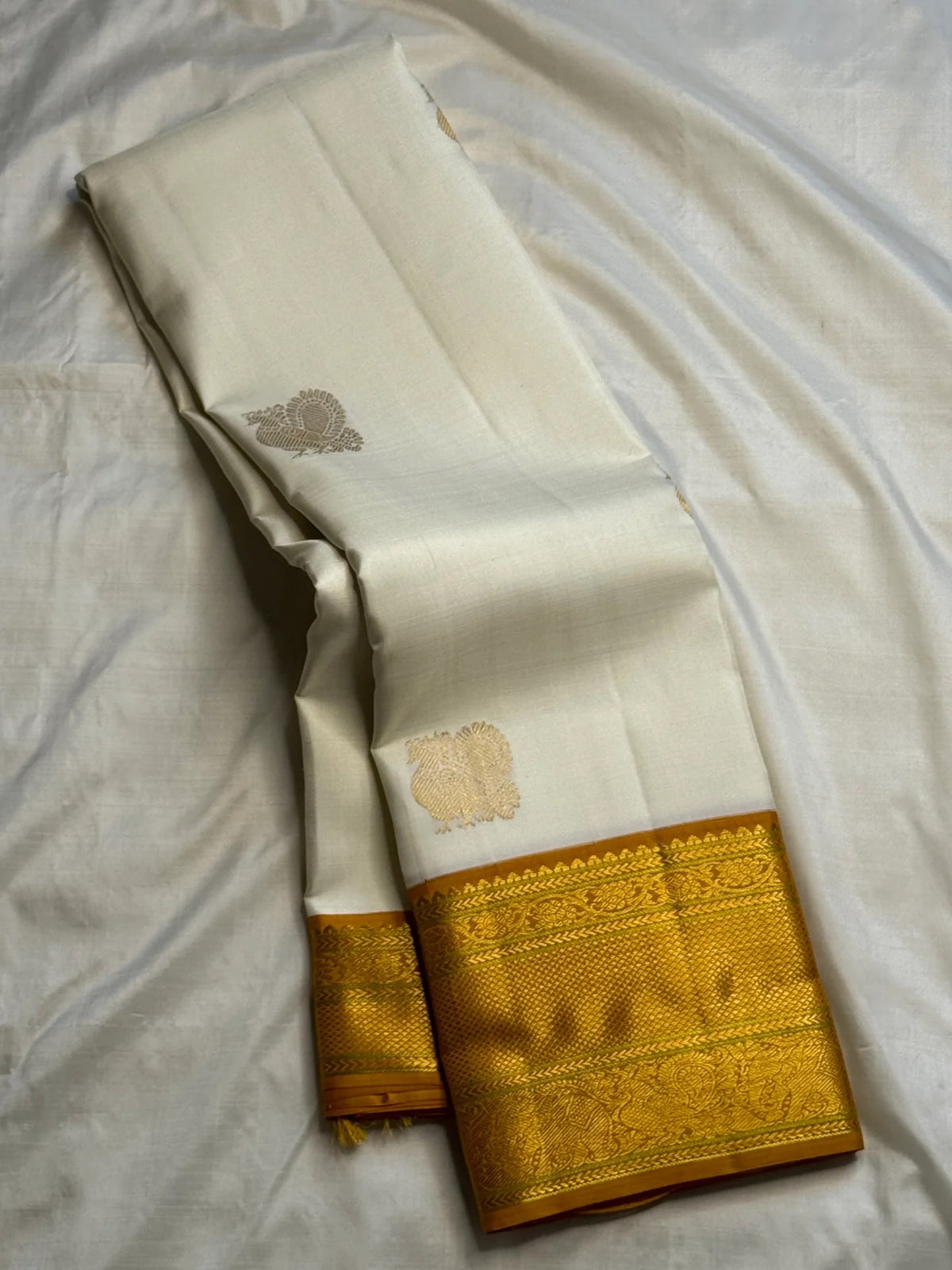 Warm Ivory Pure Silk Kanchipuram Korvai saree with rich gold zari border