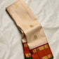 Warm ivory Pure Silk Kanchipuram Korvai saree with twin bird zari buttas and burnt orange border.