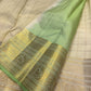 Folded Warm Ivory and lavender Kanchipuram Zari Kattam sarees showing ornate metallic borders and Mint Green edging.