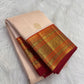 Ivory Kanchipuram silk saree with spaced antique-gold zari motifs and layered red Varisaipet border.