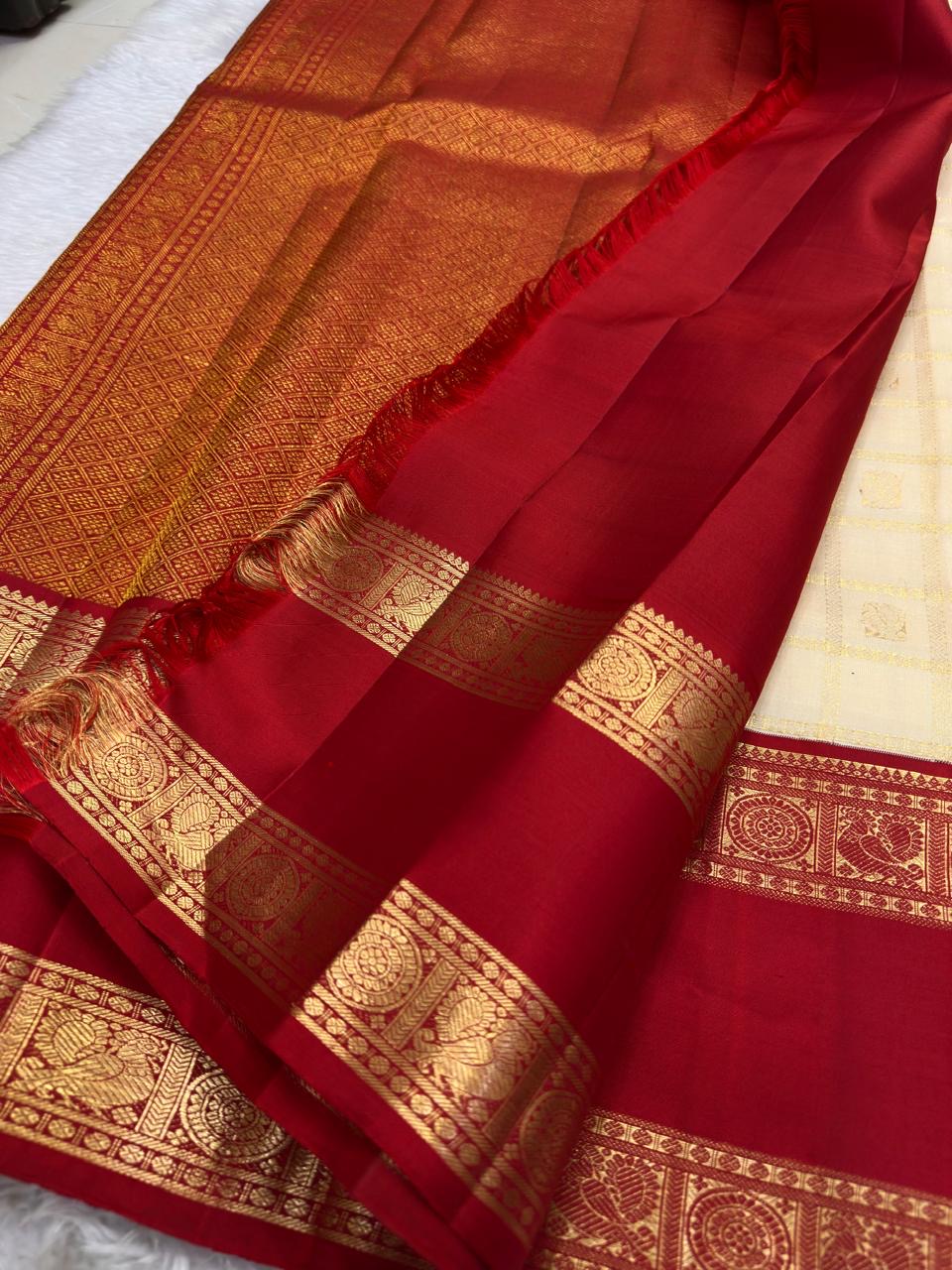 Warm Ivory Handwoven Pure Silk Kanjipuram Saree with Zari Kattam and Pillar-Box Red Border