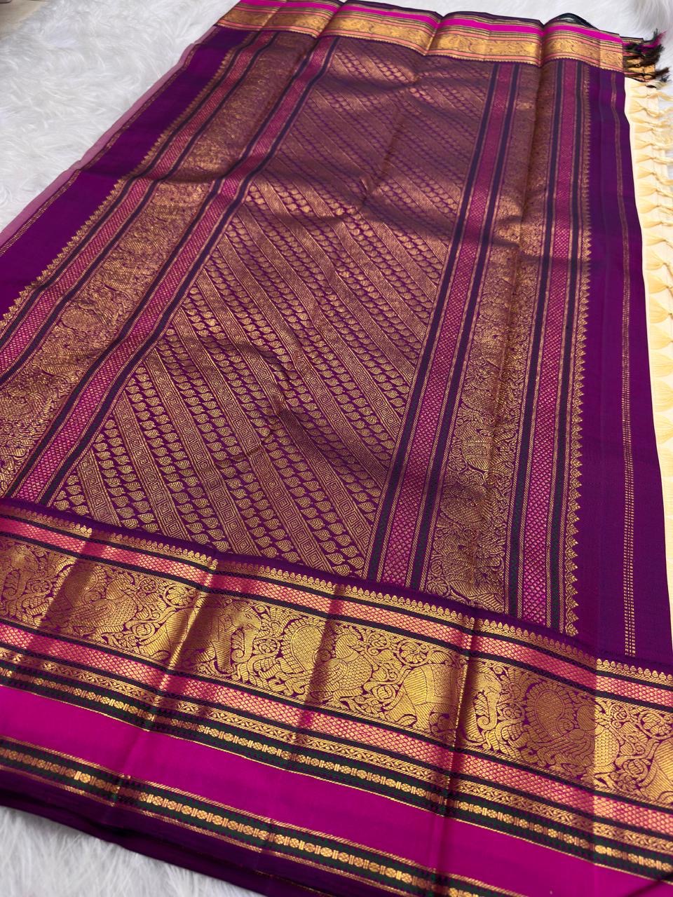 Vadamalli Magenta KanchiPattu border with ornamental gold zari and coloured silk-thread registers.