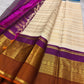 Purple VarnaJaalam Kanchipuram pallu densely handwoven with gold zari geometric patterns and ornate border registers.