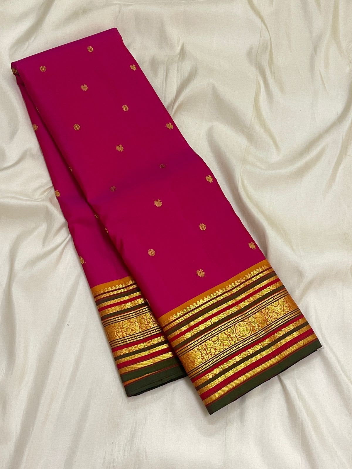 Raspberry Pink Kanjivaram with luminous Warm Orange Gold pallu