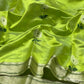 Delicate white flower motif with deep green centre and leaves woven on chartreuse green silk.