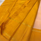 White Kancheepuram silk saree with a coordinated mustard pallu