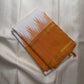Mustard-toned thazampoo reku border on a white Kanchipuram saree