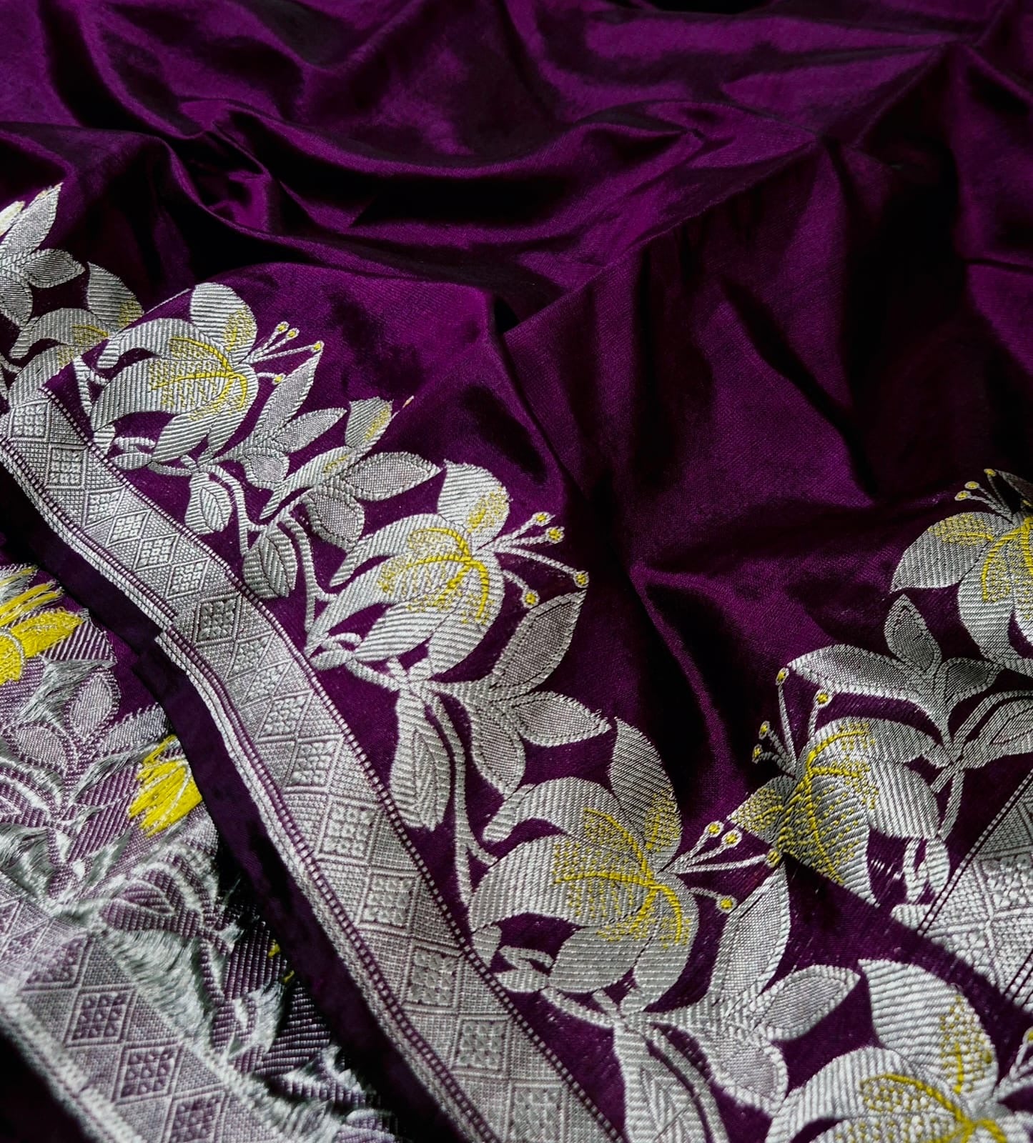 Wine Blossom Pure Silk Chanderi Saree neatly folded with Antique Silver Border