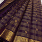 Wine purple Kanchi Pattu Zari Kattam saree folded flat showing gold check weave with Kili butta detailing — Idam Living