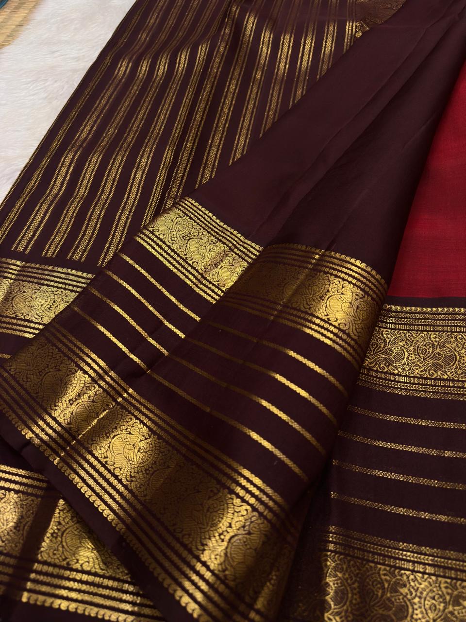 Wine red Pure Silk Kanjivaram Varisaipet saree with coffee brown border and Annapakshi weaving