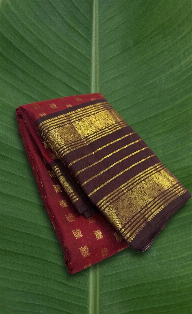 Pure Kanchipuram Varisaipet silk saree in wine red with coffee brown border and Annapakshi zari motifs