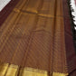 Close-up of burgundy deep coffee brown silk body showing luminous Zari Kattam gold grid on thick-ply pure mulberry silk
