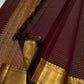Thick antique gold zari woven border with floral and geometric motifs on burgundy deep coffee brown Kanjeevaram saree