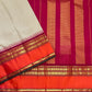 Woven floral gold zari border register on a biscuit beige and orange Kanchipuram silk saree