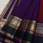 Yaanai and floral gold-zari ornament within the richly worked contrast border.