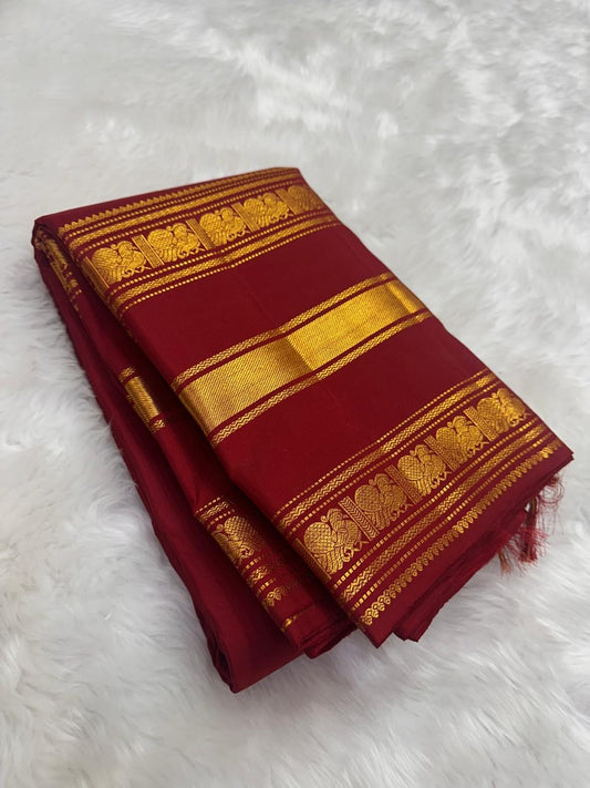 Close-up of the Yaanai gold zari Varisaipet border on the Arakku Red Kanchipuram silk saree by Idam Living