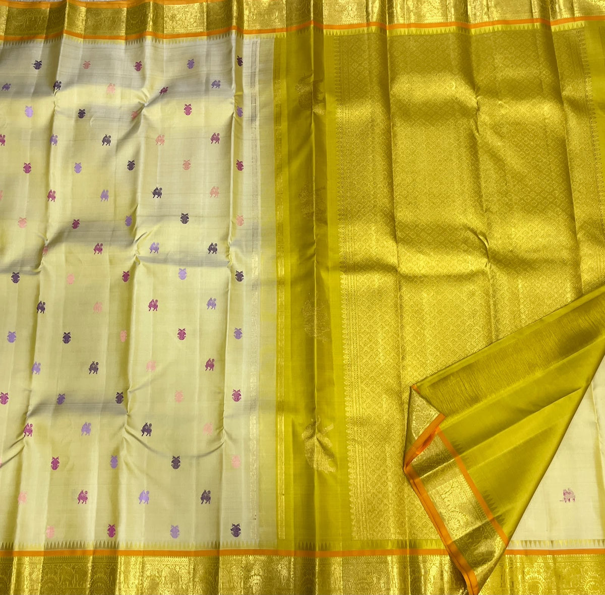 Yazhi silk-thread butta on Warm Ivory Kanjipuram saree - Idam Living