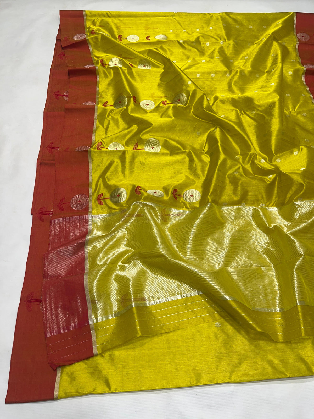 Lime yellow Chanderi saree with a woven floral border