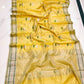 Turmeric Yellow Chanderi saree border detail with fine Leaf Green stripes on a pale metallic band