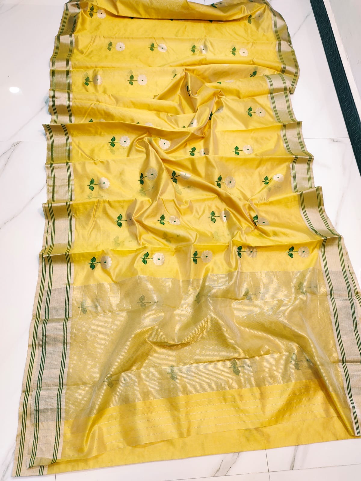 Turmeric Yellow Chanderi saree border detail with fine Leaf Green stripes on a pale metallic band