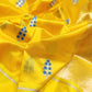 Yellow Pattu Silk Chanderi saree showing blue floral sprig motifs